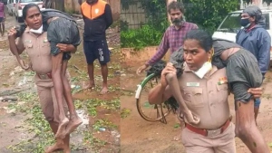 A woman inspector carries a young man to the hospital, who is presumed dead